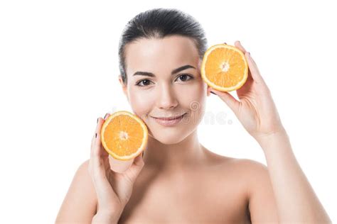 Attractive Smiling Naked Girl With Clean Skin Holding Orange Pieces