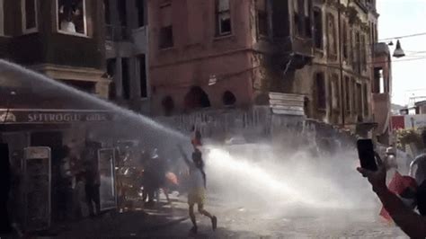 Watch Turkish People Getting Hit By Water Cannons