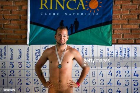 A Man Receives A Silver Medal During The First Brazilian Naturist