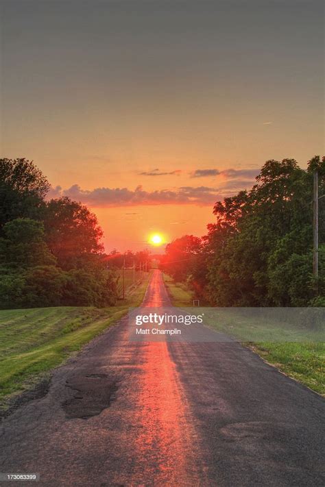 Sunset At The End Of A Long Country Road High Res Stock Photo Getty