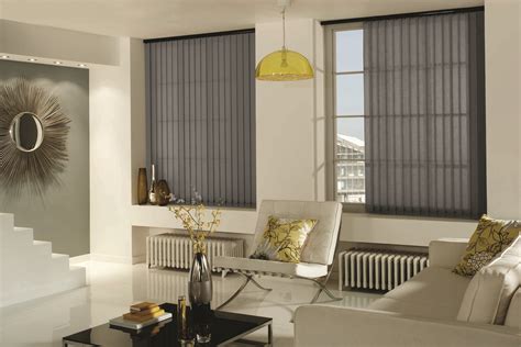 Grey sofa armchair in simple setting. Vertical Blinds by Louvolite® - Carnival - Pewter | Living ...