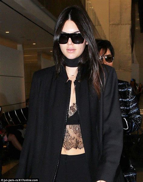 Kendall Jenner Flashes Midriff In Sheer Top As She Jets Off For Pfw