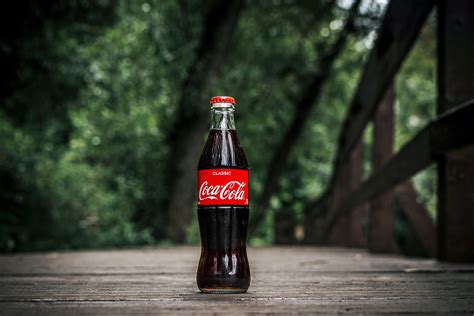 We are here to refresh the world and make a difference. Close-Up Photo of Coca-cola Bottle · Free Stock Photo