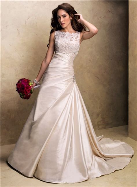 a line strapless champagne colored satin wedding dress with lace jacket