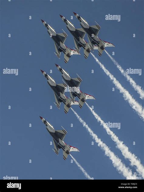 The Usaf Thunderbirds Perform Aerial Maneuvers At The Wings Over