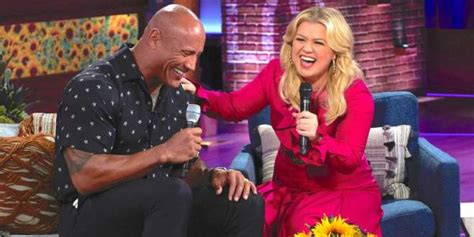 dwayne the rock johnson accepts kelly clarkson s country duet invite by singing popular dolly