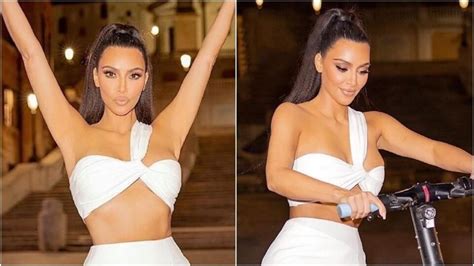 Kim Kardashian Pairs White Bralette With Mini Skirt For A Night Out In