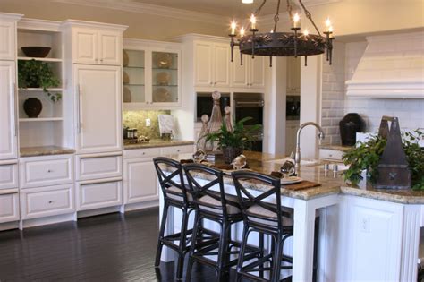 It is made of wood in two shades. 35 Striking White Kitchens with Dark Wood Floors (PICTURES)