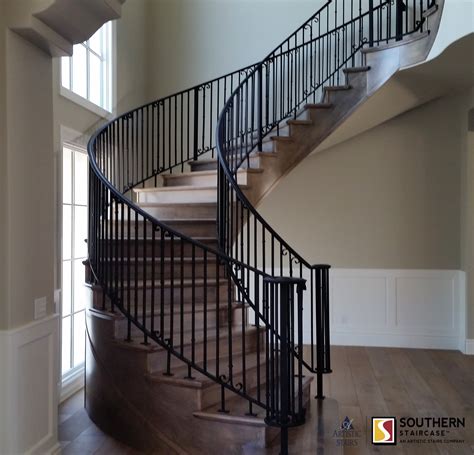 Beautiful Curved Staircase With Wrought Iron Railings Wood Railings