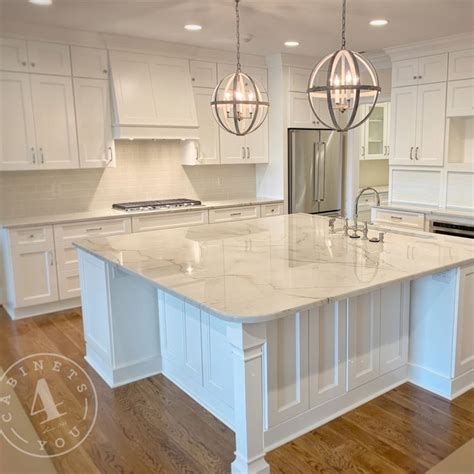 Check out these pictures for 20 kitchen island seating ideas. Large square island with seating on two sides and raised ...