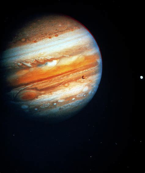 Voyager 1 Photo Of Jupiter And Two Of Its Moons Photograph By Nasa