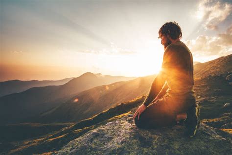 Man Praying In The Mountains Stock Photos Pictures And Royalty Free