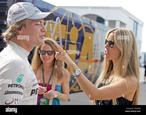 German Driver Nico Rosberg Of Mercedes Gp L And His Girlfriend Vivian Sibold R Smile In The