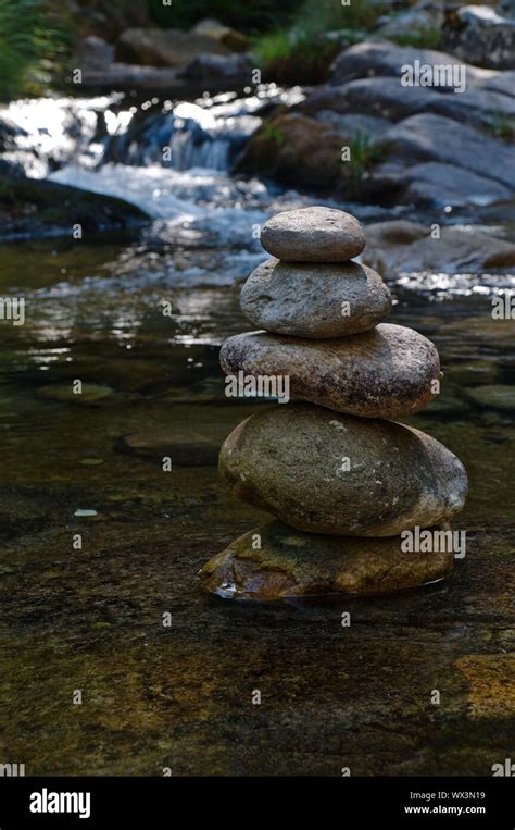 Zen Rocks Or Pebble Stack On River Waters Peaceful And Spiritual Theme