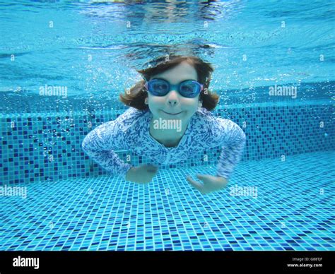Girl Swimming Underwater In Swimming Pool Stock Photo Alamy