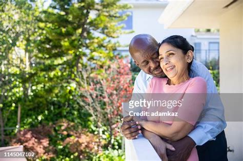 Mature Mixed Race Couple Relaxing After Work High Res Stock Photo