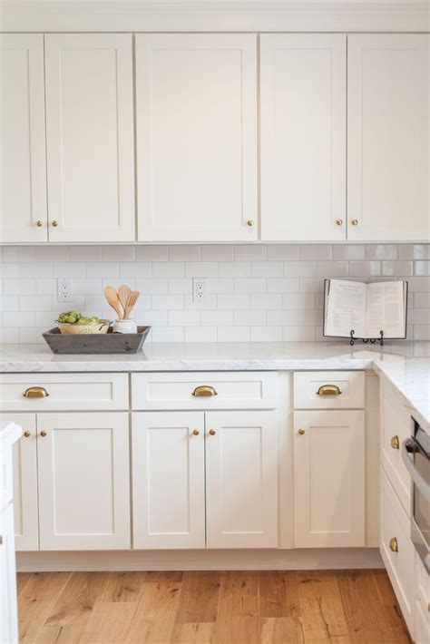 Let your plates, bowls, and more do the talking with these open shelves that prove white on white on white can totally work. Aged brass hardware | ~KITCHENS~ | Pinterest | White ...