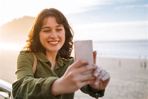 Beautiful Woman Taking Selfie With Her Phone On The Beach Stock Image