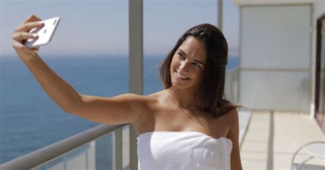 Smiling Model Taking Selfie On Balcony Stock Footage Videohive