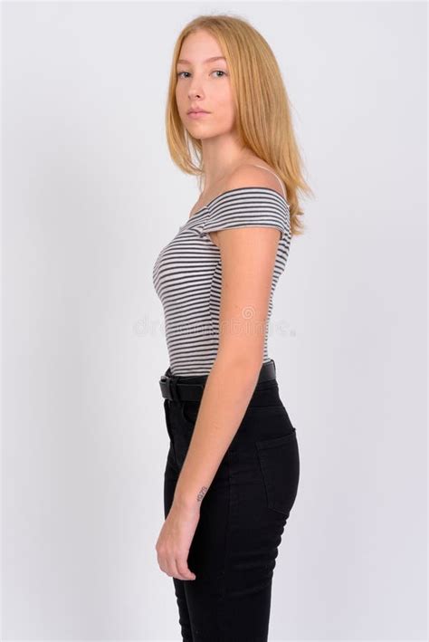 Full Body Shot Profile View Of Young Beautiful Blonde Teenage Girl