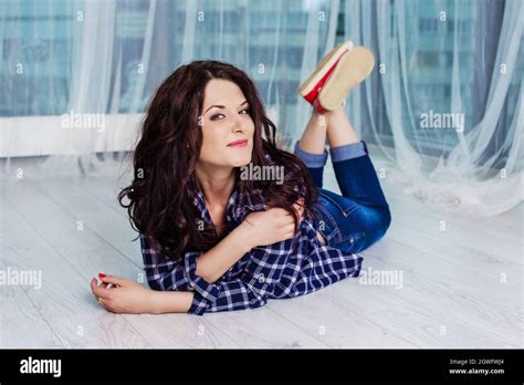 Portrait Of Beautiful Woman Lying Down On Floor Stock Photo Alamy