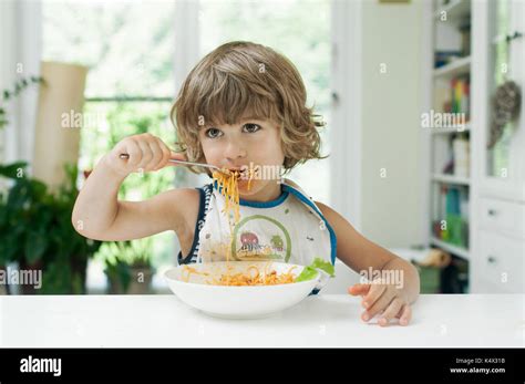 Portrait Messy Boy Eating Spaghetti Hi Res Stock Photography And Images