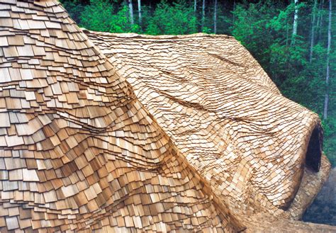 Cedar shingles make great wall siding, but they look even better with fancy sidewall shingles worked into the installation. Undulating Roof Shingles | Custom Shingles