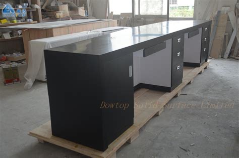 The most common black reception desk material is wood. Black diamond office reception desk