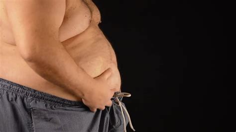 Fat Man Checks His Big Tummy Stock Video Motion Array