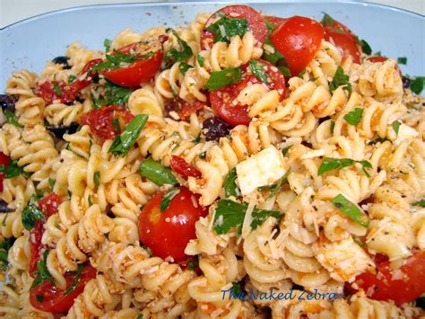 Combine the cherry tomatoes, ½ cup olive oil, garlic, basil leaves, red pepper flakes, 1 teaspoon salt copyright 2006, barefoot contessa at home by ina garten, clarkson potter/publishers, all rights reserved. The Naked Zebra: Tomato Feta Pasta Salad- Ina Garten