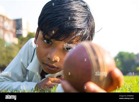Boy Catching Cricket Ball In The Ground Stock Photo Alamy