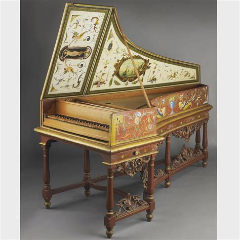 an ornately decorated grand piano sitting on top of a table