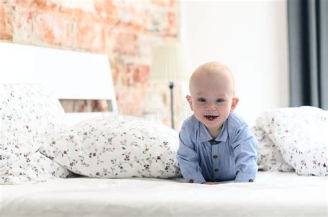 Cute Fun Little Boy Is Lying On The Parent S Bed Laughing And I Stock