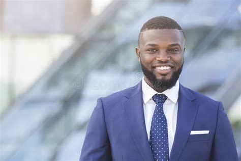 Confident Afro Businessman Smiling And Looking At Camera Outdoor Stock