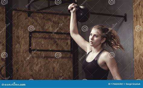 Young Woman Working Out With A Kettlebell Weight Stock Photo Image Of
