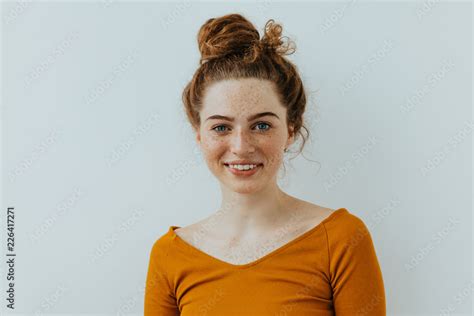 Woman Portrait Style Beautiful Blue Eyed Girl With Freckles Is Looking At Camera And Smiling