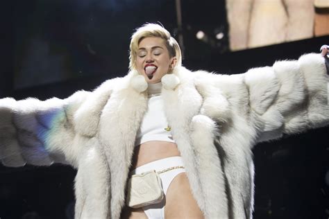 Miley Cyrus Licks Cara Delevingnes Tongue In Racy Photo