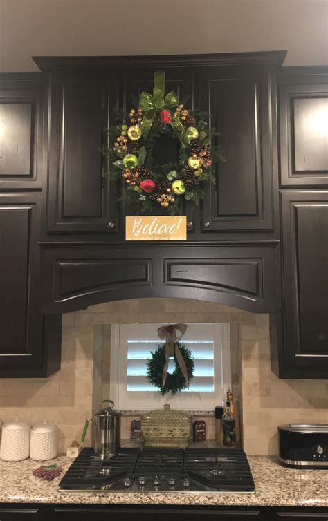 Christmas Wreath On Kitchen Cabinet Wreaths On Kitchen Cabinets