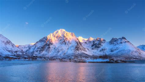Premium Photo Beautiful Snow Covered Mountains And Blue Sky Reflected
