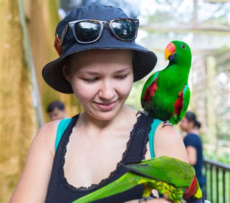 Happy Young Woman With Parrot Sitting On Her Shoulder Exotic Animals