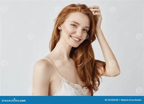 Portrait Of Beautiful Natural Redhead Girl Smiling Looking At Camera