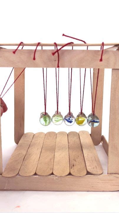 The newton´s pendulum is a device that demonstrates conservation of momentum and energy. How To Make A Simple Newton's Cradle | Newton's cradle, Kid experiments, Science projects for kids