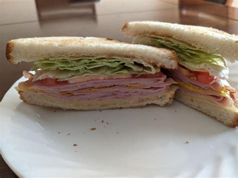 Basic Is Best Ham Swiss Mustard Lettuce And Tomato On Toasted White