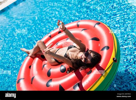 Beautiful Exotic Woman With Inflatable Watermelon Tanning In Pool Woman In Swimming Pool Stock