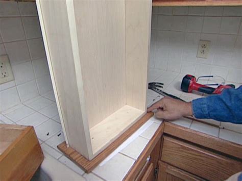 Instructions painting kitchen cabinet doors. How to Reface and Refinish Kitchen Cabinets | how-tos | DIY
