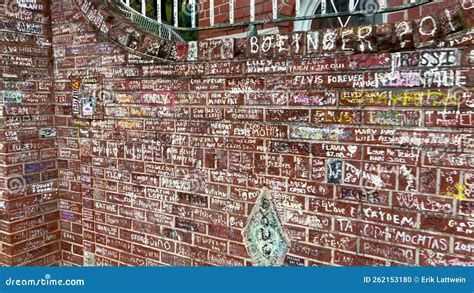 The Wall Surrounding Graceland In Memphis Covered By Writings From