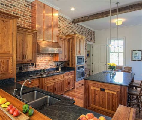 A beautiful industrial home kitchen design with an entire red brick accent wall acting as the red brick backsplash. Pin on Kitchen Design Ideas
