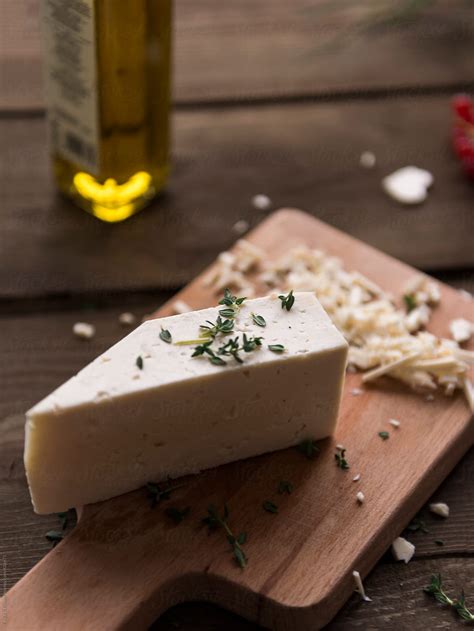 Cutting Cheese By Stocksy Contributor Danil Nevsky Stocksy