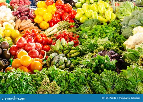 Fresh Organic Vegetables And Greens On The Grocery Market Counter