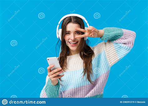 Happy Sassy Good Looking Brunette Woman In Headphones Winter Sweater